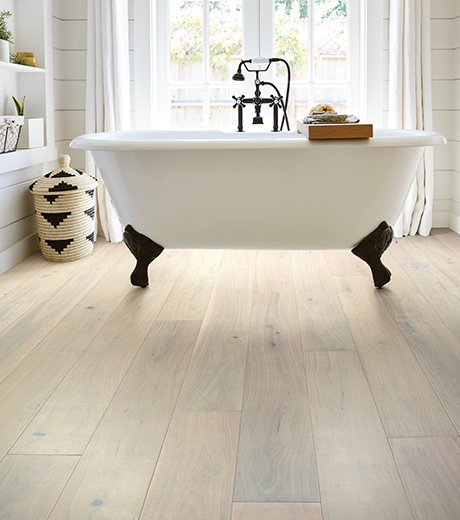 Bathroom with wood-look luxury vinyl flooring from The Carpet Yard in McLean, VA