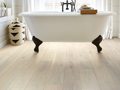 Bathroom with wood-look luxury vinyl flooring from The Carpet Yard in McLean, VA