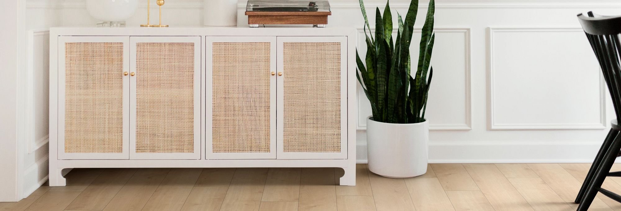 Room with white cabinet and wood-look laminate flooring from The Carpet Yard in McLean, VA