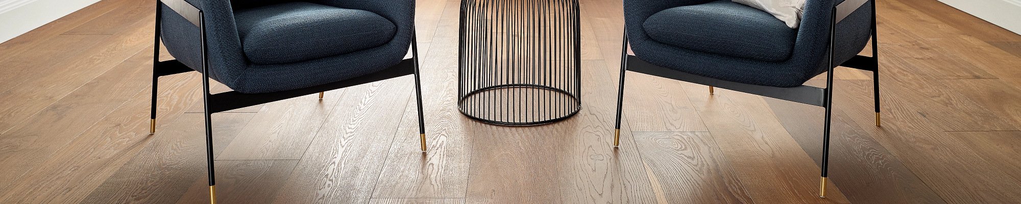 Room with two chairs on hardwood flooring from The Carpet Yard in McLean, VA